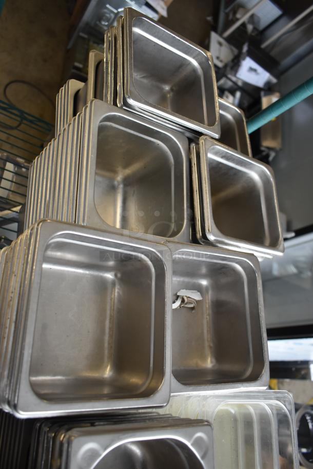 Tier lot of stainless steel and poly drop-in bins, mostly new. Some show minor use with light scratches.