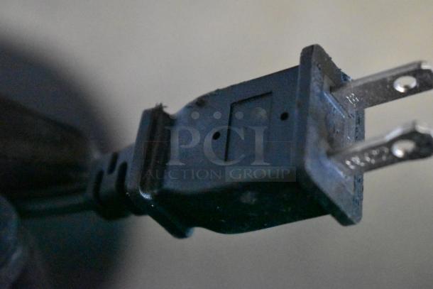 Close-up image of a power plug for a Dreo Tower Fan, 120 volts, 1 phase.