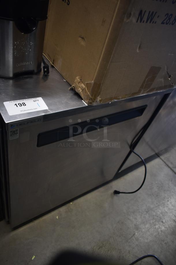 Delfield single door undercounter cooler on commercial casters, 115 volts, 1 phase. Features visible logo and QR code.