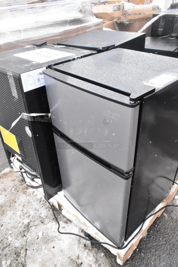 Four mini coolers including Arctic King ARM32D5ABB and Galanz GLR33MBKE23 on a pallet. 120V, 1 Phase. Good condition.