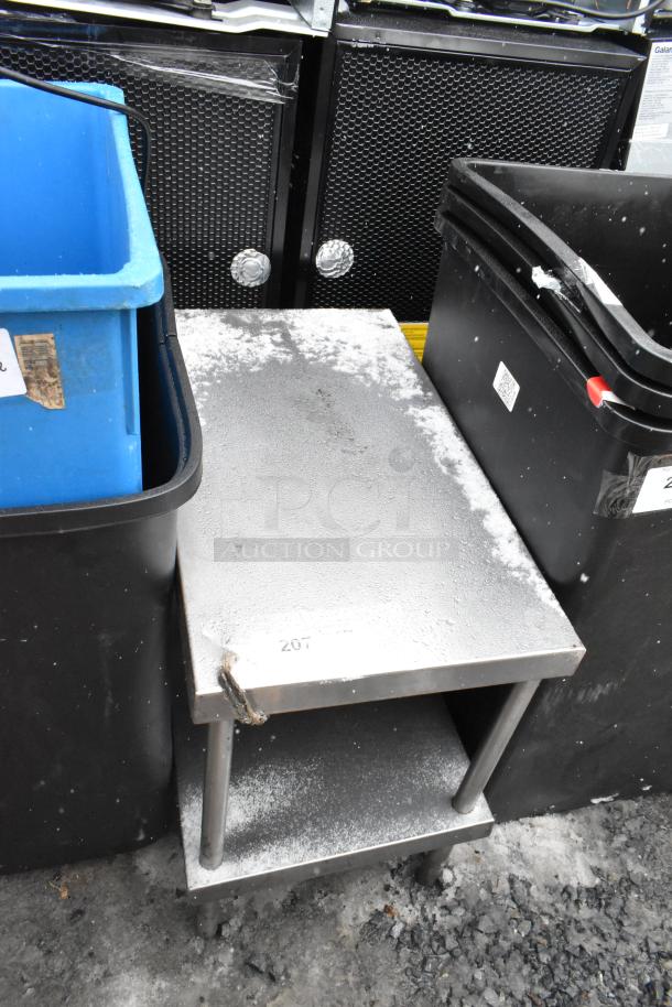 Commercial equipment stand with under shelf, metal, used condition, visible label "207", sturdy construction.