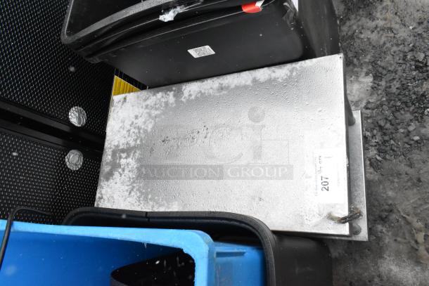 Commercial equipment stand with under shelf, metallic finish, used condition, visible wear, auction tag marked "207".