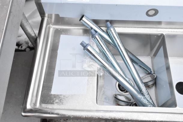 Brand new KoolMore 2 bay sink with dual drain boards, stainless steel, scratch and dent condition, unassembled parts shown.