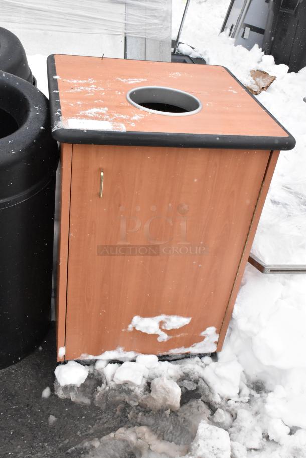 Wooden trash can shell with black rim and circular opening, showing some snow accumulation. Includes two black shells.