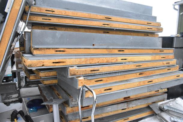 Norlake walk-in box panels stacked, featuring insulation and metal exterior. Used condition, part of 18'x6'x8' combo unit.