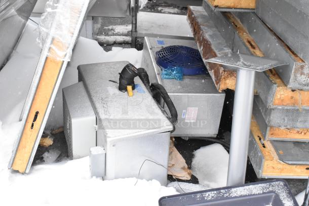 Norlake walk-in cooler/freezer components, featuring Tecumseh compressor, two evaporator fans, shown in snowy condition.