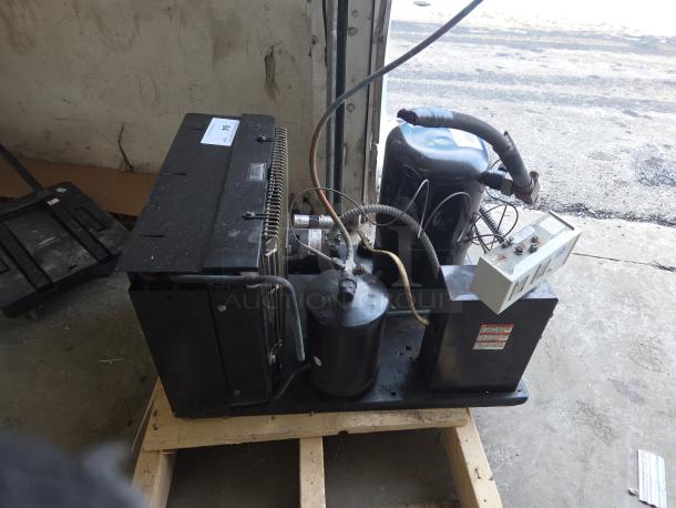 Norlake Tecumseh compressor unit on pallet for walk-in cooler/freezer, showing wiring and control box. Condition appears used.
