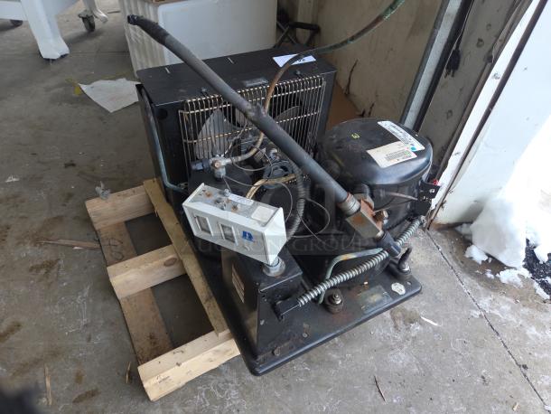 Norlake Tecumseh AW613ET-111-P21 compressor on pallet, 1 phase, 208-230V, with visible wiring and connectors.