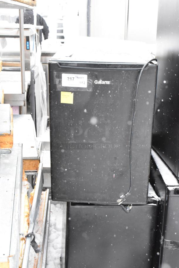Galanz mini cooler, model GLR33MBKE23, black, 120 volts, 1 phase, visible snow, label with lot number 217.