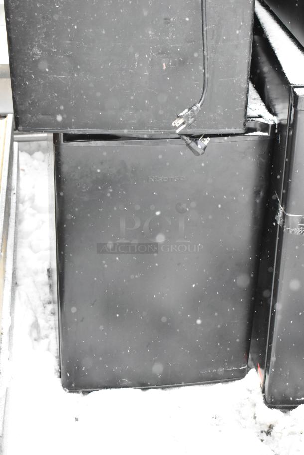 Eight mini coolers including Galanz GLR33MBKE23 and EdgeStar CMF151L, shown stacked and plugged in, fair condition.