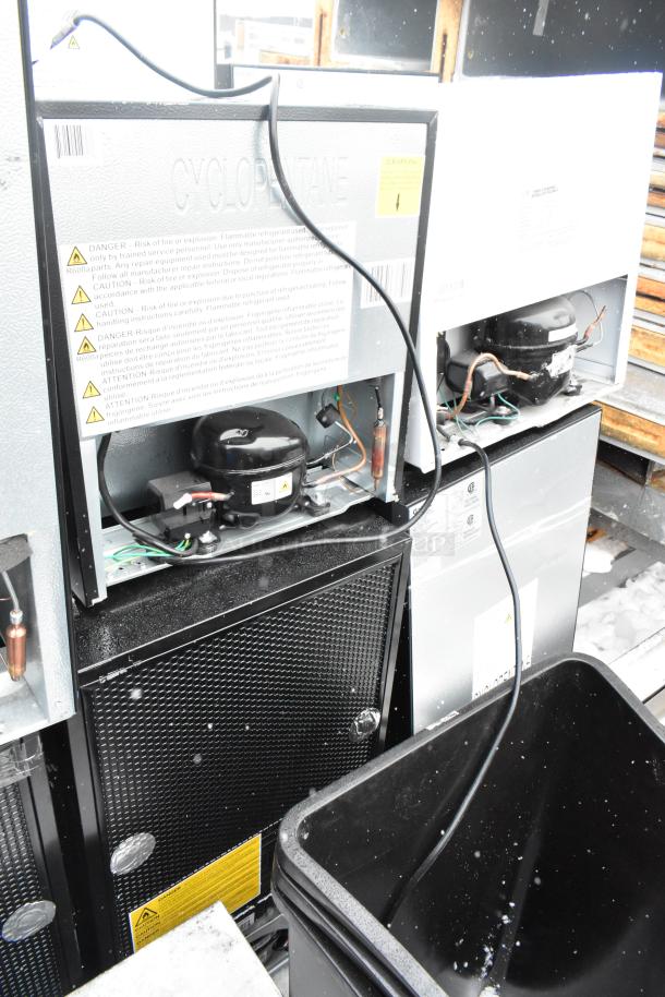 Eight mini coolers, including Galanz GLR33MBKE23 and EdgeStar CMF151L models, 120 volts, 1 phase, showing internal components and caution labels.