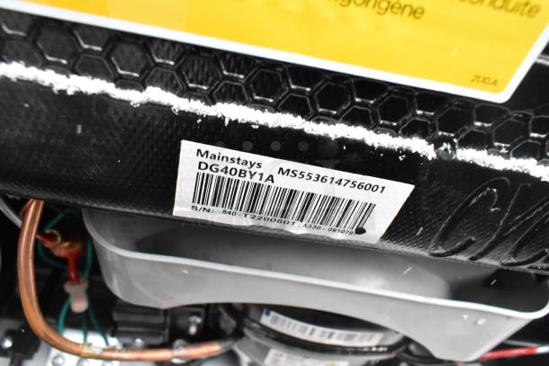 Mainstays DG40BY1A tag on mini cooler showing model and serial number. Part of a lot of 8 various coolers. 120 volts, 1 phase.