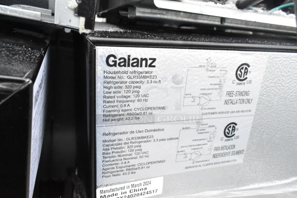 Galanz mini cooler, model GLR33MBKE23, 3.3 cu. ft., 120 VAC, 60 Hz, label showing specifications and manufacturing details.