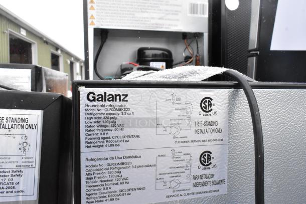 9 Galanz mini coolers, models GLR33MBKE23 and GLR31TS1E02. 120V, 1 phase, 3.3 cu. ft. capacity, silver, label details included.