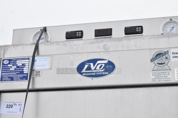 Stainless steel LVO FL14E commercial pot and pan washer. 460V, 3 Phase. Features dials, labels for voltage specs, and brand logo.
