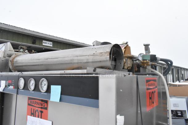 Douglas Commercial Front Load Pot and Pan Washer, stainless steel, with visible warning labels and temperature dials.