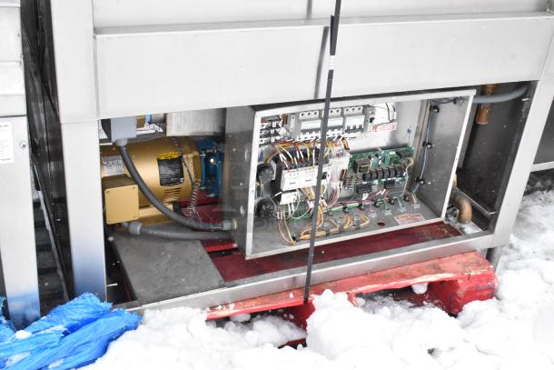 Douglas Commercial Front Load Pot and Pan Washer, showing internal wiring and motor. Visible wiring details and caution label.