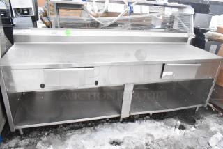 Win-holt stainless steel table with two drawers and under shelf, lightly used condition, barcode and green sticker visible.