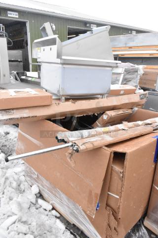 12 various items including a stainless steel sink, shelf kit, and over shelf, in worn packaging. Auction lot.