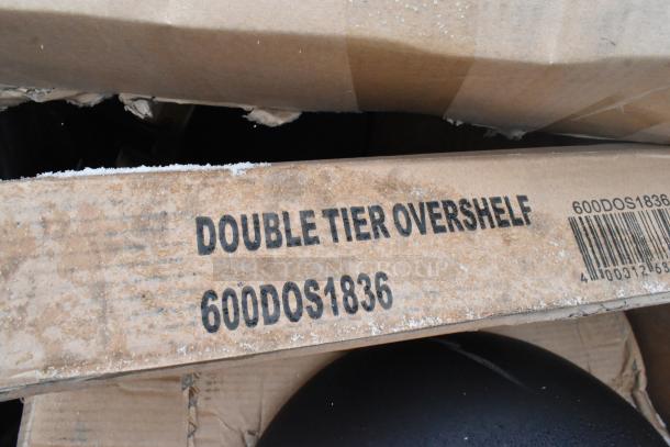 Cardboard box labeled "Double Tier Overshelf" with model number 600DOS1836, signs of wear and barcode visible.