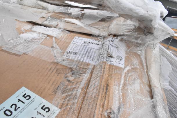 Cardboard boxes wrapped in plastic, showing labels with "VITO panel systems" and product specifications.