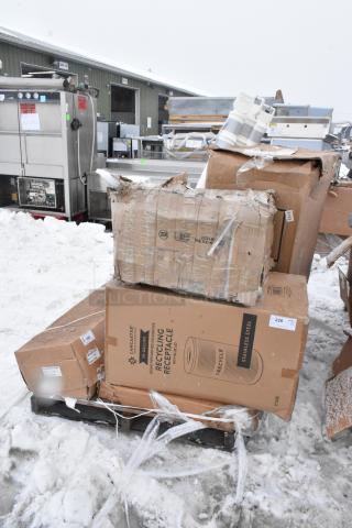 Fourteen various items include shelves and chair cushions in boxes, visible labels indicate Lancaster 70-gallon recycling receptacles.