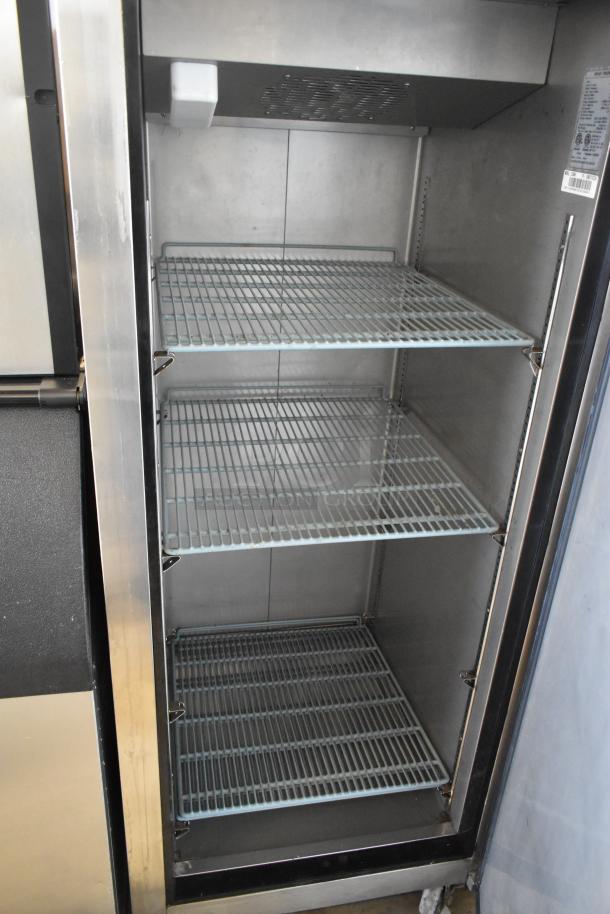 Dukers D28AF commercial single door reach-in freezer with shelves, on casters. Stainless steel interior, 115V, 1 phase.