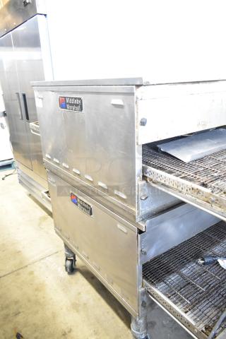 Two Middleby Marshall PS638G conveyor pizza ovens, natural gas, 89,000 BTU, on commercial casters, in used condition.