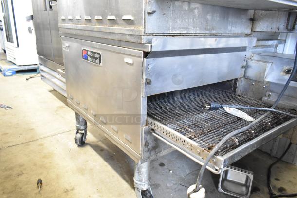 Middleby Marshall PS638G conveyor pizza ovens on casters, natural gas, 89,000 BTU, used condition, visible branding.
