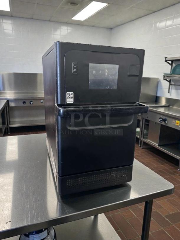 Commercial countertop rapid cook microwave oven, black, touch display, 115V, in exceptional condition, fully tested and operational.