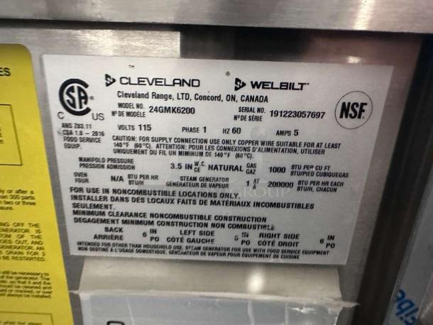 Alt text: Cleveland 24GMK6200 commercial gas steam kettle label, NSF & CSA certified, model and serial numbers, operational specs.