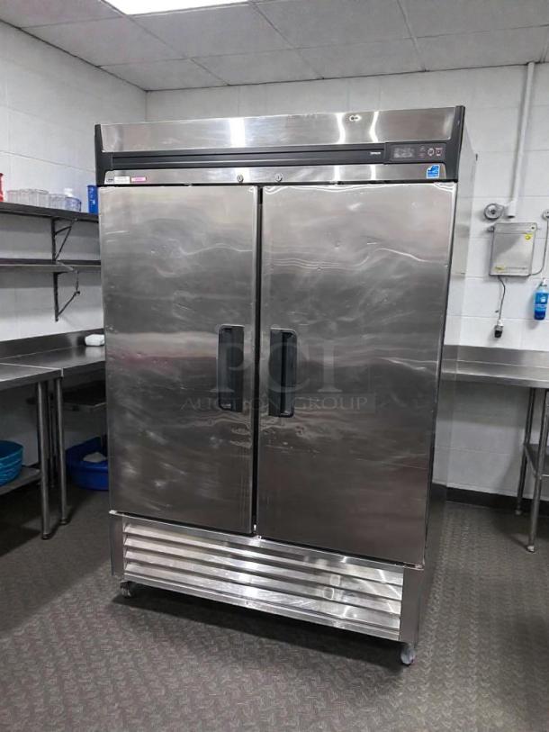 Commercial grade double door reach-in refrigerator in stainless steel; UL & NSF listed, fully tested and operational.