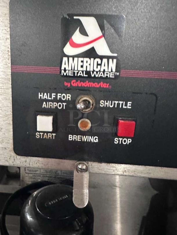 American Metal Ware R49-S coffee brewer control panel showing start, brewing, and stop buttons. Brand label visible.