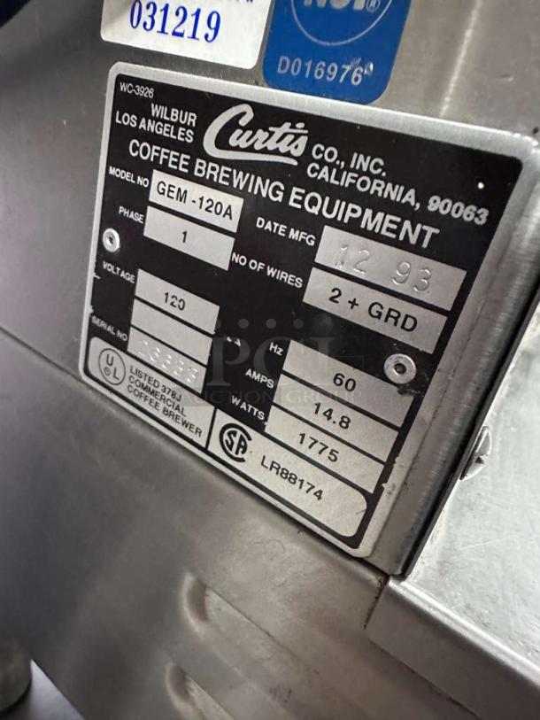 Wilbur Curtis Gemini System coffee brewer label, model GEM-120A, UL & NSF listed, tested, dual station, serial info visible.