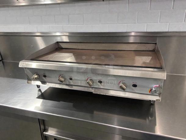 Stainless steel Cooking Performance Group commercial gas griddle, model CPG-L-GRD-0405, in superior condition, fully operational.