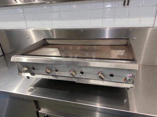 Stainless steel CPG commercial gas countertop griddle, model CPG-L-GRD-0405, in superior condition with control knobs, fully tested.