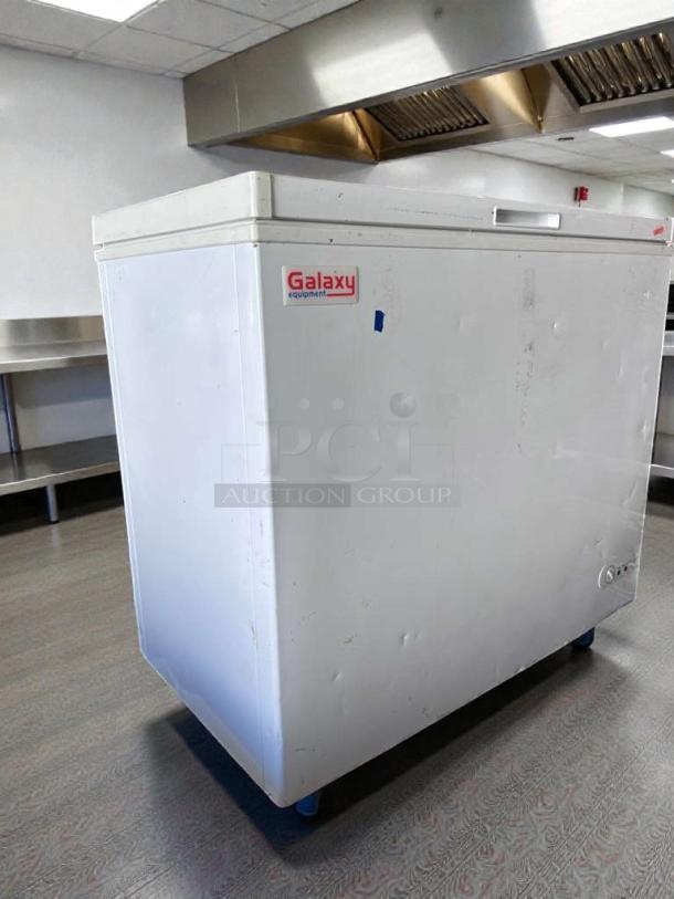 Galaxy 177CF7 commercial chest freezer in excellent condition, 7 Cu. Ft., 115V, R600a. White finish with logo visible. Fully operational.
