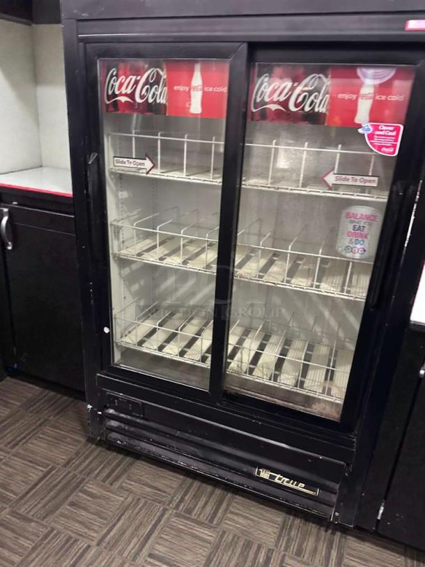 Coca-Cola branded True GDM-33SL-54EM-LD commercial glass door refrigerator, premium condition, UL listed, fully operational.