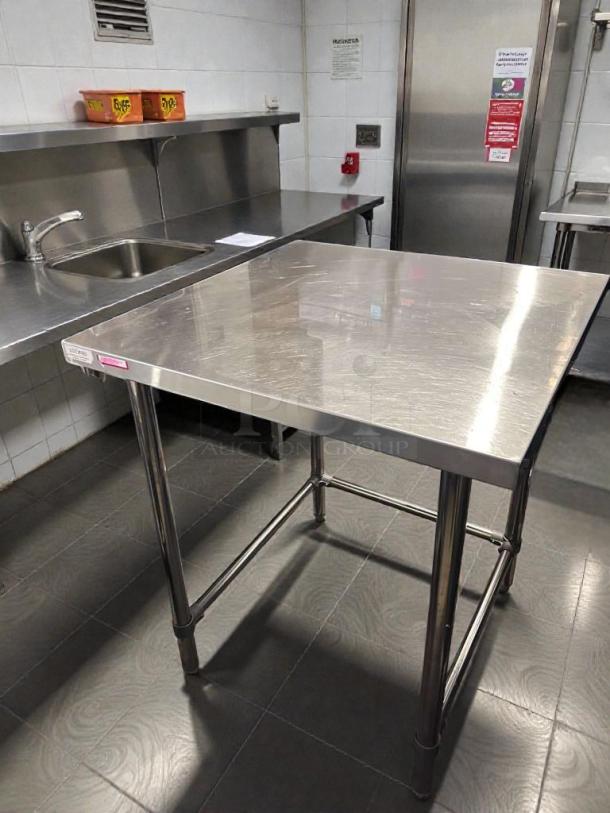Commercial stainless steel work table, 48" x 30", top-tier condition, heavy-duty, fully tested, unbranded.