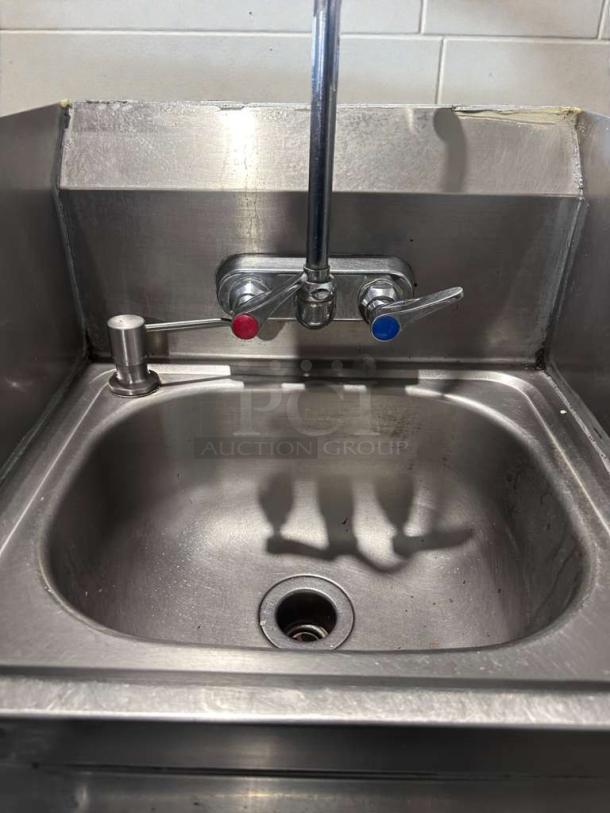 Commercial stainless steel hand wash sink with gooseneck faucet and paper towel dispenser, high-grade condition, model SS-S-HWS-0419.