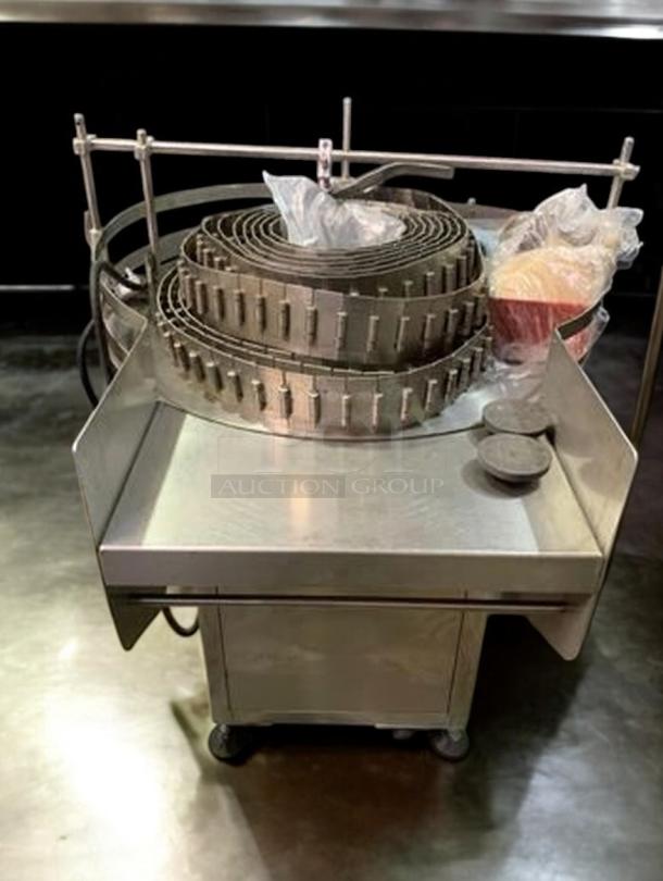 Stainless steel rotary round bottle washer, Tang model. Fully tested, excellent condition, part of a 9-piece production line.