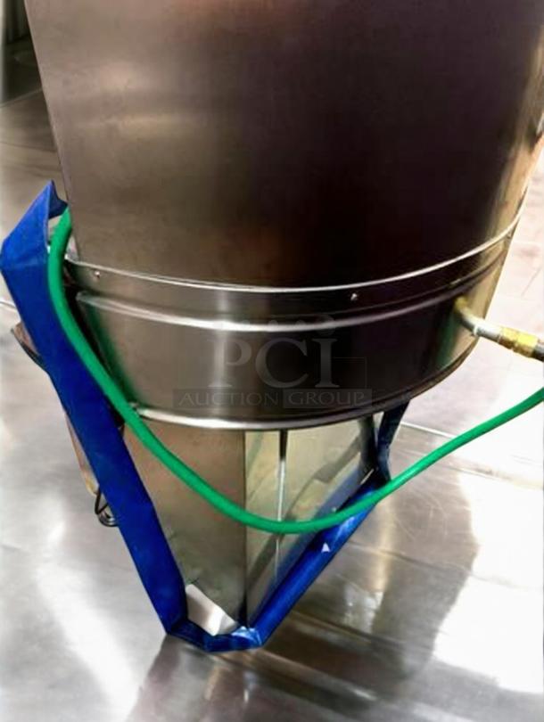 Stainless steel Tang Rotary Round Bottle Washer with automatic rinse, excellent condition, fully tested, shown with hoses.