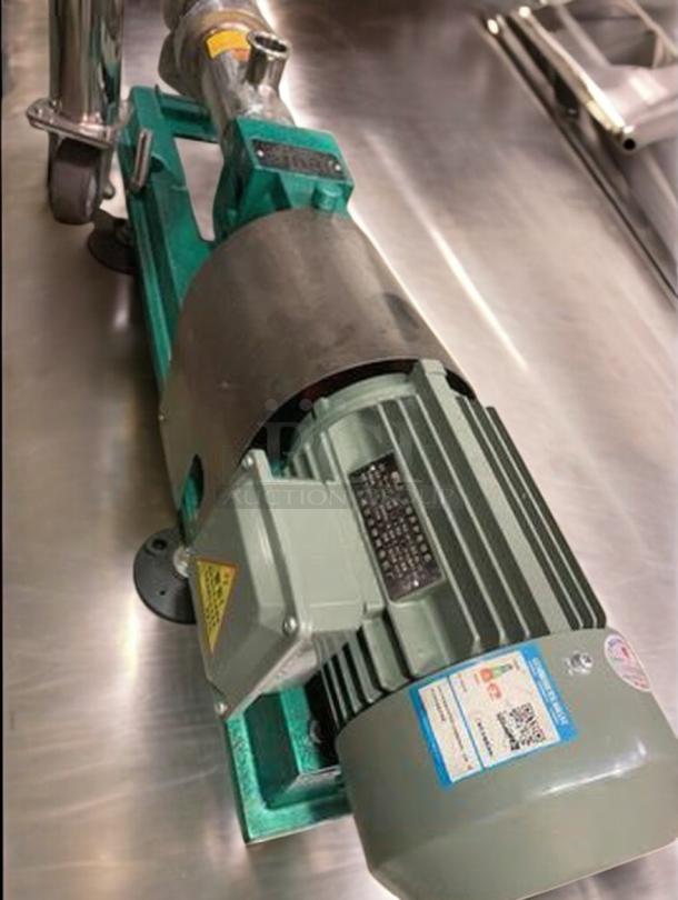 Tang Screw Feeding Pump, premium condition, for sauce/liquid transfer, tested operational, includes model and safety labels.