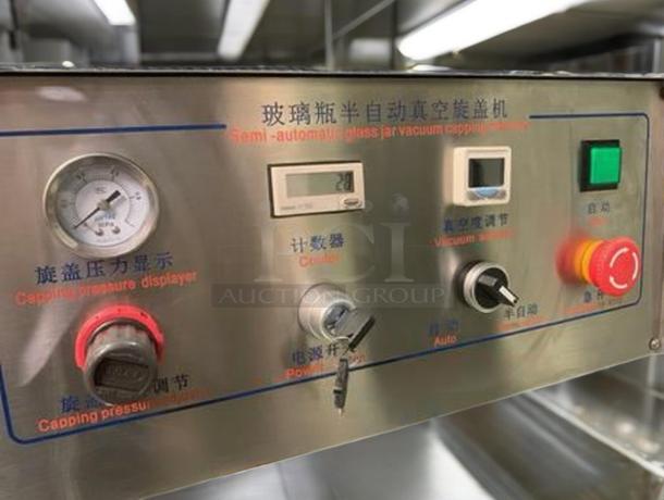 Tang Machinery Four-Station Semi-Automatic Vacuum Capper. Includes pressure display, control panel, and vacuum settings. Fully tested.