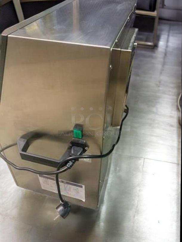 Tang Machinery TGM-TY01 bottle labeling machine, premium condition, high-speed 360° wrap-around. Fully tested. Power switch and cord visible.