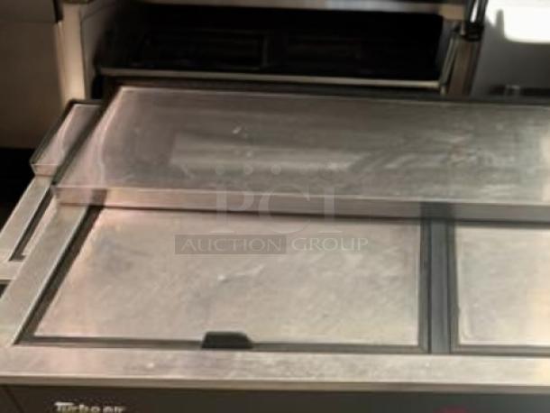 Turbo Air TBC-50SB-N6 bottle cooler, 50" wide with sliding lid, in high-grade condition. UL listed, model visible.