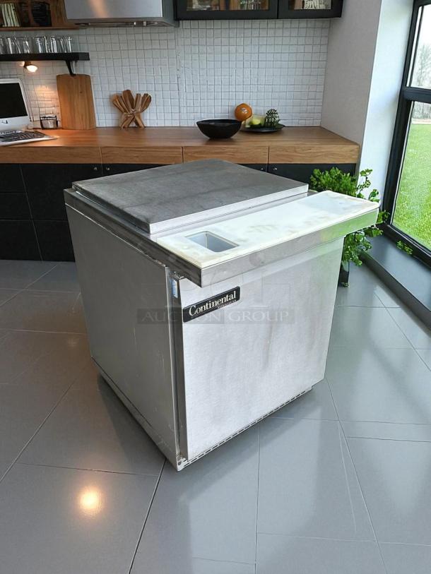 Continental SW27-12M refrigerated prep unit, stainless steel, 27" wide, 7.4 cu. ft., excellent condition, UL & NSF listed.