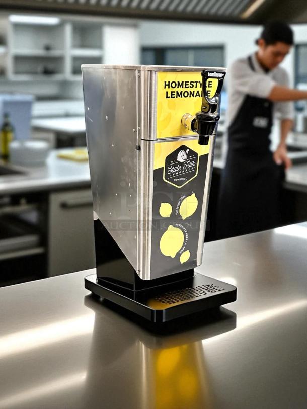 Newco FPM-1 countertop lemonade dispenser, stainless steel, NSF listed, fully tested, with "Homestyle Lemonade" label.