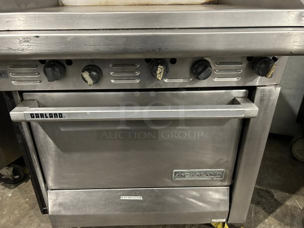 Garland G36-G36R 36" commercial gas range with full griddle and standard oven, stainless steel, fully operational, natural gas.