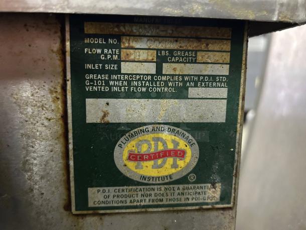 PDI Universal LJ-20 grease interceptor trap label showing flow rate, grease capacity, and PDI certification.